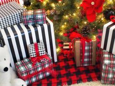 presents under the christmas tree are wrapped in black and white plaid