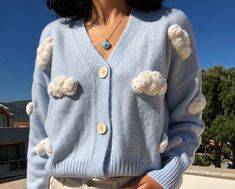 Unique Cardigan Chunky Cloud Embroidery,Cozy Cloudy Punch Needle Women Sweater, Handmade Crop Knit Outfit,Gift kit for her,Baby Blue Y2k Top This cardigan is a UNIQUE and one and only piece. It is handknitted with mixture of cotton and polyester yarn. (%70 Cotton, %30 Polyester) Chunky Cloud Pattern is created with Punch Needle Technique and %100 baby cotton yarn is used. EACH CARDIGAN IS MADE TO ORDER, BUTTON COLOUR MAY VARY 100% Handmade, Free Shipping SIZE: One size fits for 34,36,38,40 // XS Cute Blue Knit Cardigan, Cute Hand Knitted Blue Sweater, Cute Blue Hand Knitted Sweater, Cute Blue Hand-knitted Sweater, Cute Blue Knit Sweater, Handmade Cozy Blue Cardigan, Handmade Blue Sweater For Spring, Cute Blue Winter Cardigan, Handmade Blue Spring Sweater