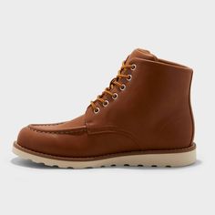 These Niles Moc Toe Boots from Goodfellow & Co™ are a versatile addition to your shoe wardrobe. The faux-leather design features a cognac-color upper contrasted with an off-white TPR outsole. These mid-calf boots are enhanced by a classic lace-up front with chrome eyelets, a round closed toe, stitched detailing and a cushioned insole. Experiment with different clothing combinations to showcase your unique style and make these moc toe boots a stylish staple in your collection. Goodfellow & Co™: F Casual Moc Toe Lace-up Boots With Goodyear Welt, Timberland Brown Moc Toe Waterproof Boots, Classic Lace-up Boots With Goodyear Welt And Moc Toe, Brown Goodyear Welted Moc Toe Lace-up Boots, Brown Gore-tex Boots With Moc Toe, Winter Duck Boots, Ankle Rain Boots, Moc Toe Boots, Cognac Color