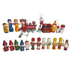 a group of christmas figurines sitting next to each other