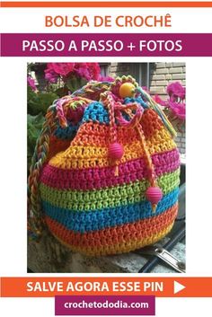 a colorful crocheted bag sitting on top of a table