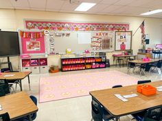 an empty classroom with desks and chairs