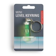 the keyring is green and has a small plastic tube with a light on it