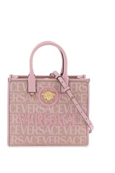 Versace tote bag made of jacquard canvas with Versace Allover pattern and decorated with La Medusa plaque at front and tone-on-tone lettering logo emrboidery. Strap and magnetic button closure, two interior zippered pockets, top handles, adjustable and removable shoulder strap. Gold-finished metalware. Size Info STANDARD Color Detail Mixed colours Made In Italy Material 60%PL 40%CO Season One fall Season Two winter Product bags Brand Versace Size And Fit Bag Length = 29,5 cm, Bag Height = 24 cm,