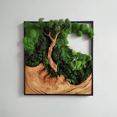 a piece of wood that has been cut into pieces with trees and grass on it