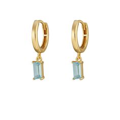 Turn heads with these feel-good baguette charm hoop earrings! The classic hoop studs suspend a baguette-cut aquamarine cubic zirconia stone, whose light blue hues emit a tranquil yet vibrant aura. Splash some colour into your everyday look with these captivating blue stone drop hoops. This year's trend craves bright colors that pop--these aquamarine earrings brighten up your outfit no matter the weather!  All Scream Pretty jewellery will be beautifully presented in our signature branded packaging. Material: 18ct Gold Plated Recycled Sterling Silver and Aquamarine Cubic Zirconia.  To keep in perfect condition, polish gently using a silver cloth to remove any tarnish. Gold plating is a surface finish and may wear over time. Avoid chemicals and remove when showering and swimming. Baguette Drop Earrings, Light Blue Earrings Aesthetic, Hoco Jewelry, Hoops With Charms, Light Blue Earrings, Gold Earrings Wedding, Blue Charm, Earrings Aesthetic, Aquamarine Earrings