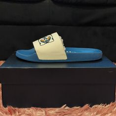 Slides Are A Women's Size 9 Sporty Slides With Round Toe And White Sole, Blue Flat Sneakers With Cushioned Footbed, Blue Flat Synthetic Sneakers, Coach Casual Slip-on Sandals, Blue Sporty Flat Sneakers, Sporty Blue Flat Sneakers, Blue Flat Sneakers For Sports, Casual Low-top Sandals With Rubber Sole, Casual Flat Sandals For Sports