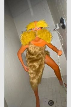 a woman in a costume is standing on the toilet