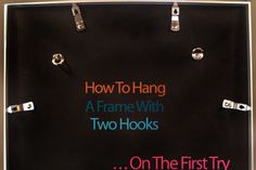 a sign that says how to hang a frame with two hooks on the first try