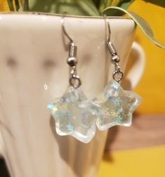 These adorable, dainty earrings would make the perfect accessory to your summer wardrobe! Features confetti filled resin charms with stainless steel hypoallergenic ear hooks. Not intended for children. Cancellations are accepted within 24 hours. Earrings Kawaii, Resin Charms, Cute Aesthetic, Ear Hook, Dainty Earrings, Summer Wardrobe, Favorite Jewelry, Jewelry Earrings Dangle, Dangle Drop Earrings