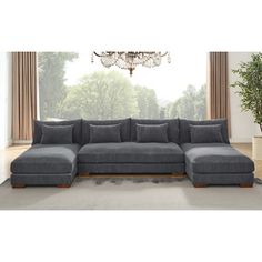 a living room with a large gray sectional couch