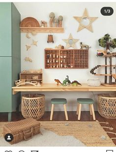 a room filled with lots of wooden furniture and decorations on the wall next to a green cabinet