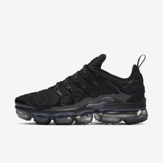 BLACKED-OUT AIR. The Nike Air VaporMax Plus looks to the past and propels you into the future. Made with at least 20% recycled material by weight, it keeps the future in mind while including design elements from the '98 Air Max Plus. Revolutionary VaporMax Air technology provides comfort and a modern look, while the floating cage, heel logo and iconic whale tail midfoot shank add heritage style. A sleek all-black upper and black rubber pods on the outsole show off your dark side. Benefits Origin Black Vapormax, Vapormax Plus Black, Nike Vapormax Plus, Vapormax Nike, Nike Vapor Max, Vapour Max Nike, Nike Air Vapormax Plus, Air Vapormax Plus, Nike Vapormax