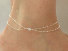 Sterling silver moonstone ankle bracelet This listing is for a lovely double strand sterling silver anklet with a 6mm faceted moonstone bead. The length of the anklet measures approximately 24cm (9.5) Every item from Gemma Jolee comes packaged ready for gift giving. Please contact me if Delicate Silver Jewelry For Summer, Delicate Silver Anklets For Summer, Delicate Silver Summer Jewelry, Delicate Adjustable Silver Anklets, Silver Dainty Anklets For Wedding, Elegant Sterling Silver Anklets For Summer, White Sterling Silver Anklets As Gift, Turquoise Ankle Bracelet, Moonstone Anklet