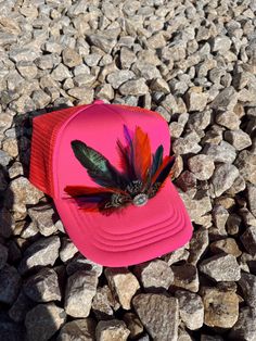 This feather trucker hat is perfect for the rodeo, beach, or anywhere you want to be stylish and protected from the sun. It comes with a variety of different color feather with a western turquoise pin in the middle of it to tie it all together.  These trucker hats have a unique to the hat feathers and other add ins to make the hat one of a kind. Every hat is customizable free of charge so please feel free to reach out with any customization question and we can make the hat your own!  Hat Details: It is a 100% polyester foam trucker hat. It is preserved and is in one size fits most with an adjustable snap back. Western Style Trucker Hat With Curved Brim For Beach, Western Snapback Hats For The Beach, Western Style Snapback Beach Hat, Western Style Trucker Hat For Beach In Summer, Western Style Trucker Hat For Summer Beach, Bohemian Snapback Trucker Hat For Summer, Bohemian Trucker Hat For Summer Festivals, Western Style Summer Trucker Hat For Beach, Bohemian Summer Trucker Hat For Festival