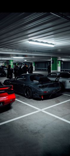 several cars are parked in a parking garage