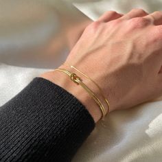 "🐍  Unisex Ultra Slim Snake Chain Bracelet is the epitome of sophistication and style. The bracelet is expertly crafted from high quality 14K gold plated silver, featuring a sleek and slender snake chain design. The bracelet's minimalist aesthetic makes it a versatile and stylish choice for any outfit, from casual to formal. The 14K gold plating adds a touch of luxury and shine, making it the perfect accessory to elevate any look. Wear it alone as a statement piece, or layer it with other brace Matching Gold Bracelets, Couple Gold Bracelets, Couple Bracelets Aesthetic, Slim Hands, Matching Jewelry For Couples, Love Knot Bracelet, Gold Knot Bracelet, Couples Bracelets, Gold Bracelet Simple