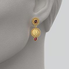 Discover our exquisite Made in Italy Dangle Earrings, crafted with meticulous artistry in either 14k or 18k gold and adorned with stunning natural Garnet cabochons ( 4 mm). Inspired by the grandeur of ancient Greece, these earrings feature a captivating reproduction of an ancient Greek coin, portraying the heroic Head of Herakles proudly donning the iconic lion skin. 14k or 18k gold Made in Italy Length 32 mm, Width 14 mm Byzantine Jewelry With Cabochon For Gifts, Byzantine Cabochon Jewelry For Gifts, Byzantine Style Cabochon Jewelry For Gifts, Byzantine Style Cabochon Jewelry Gift, Gold Plated Fine Jewelry Earrings, 14k Yellow Gold Gemstone Earrings, Gold Plated Earrings With Polished Finish, Luxury Yellow Gold-plated Earrings, Yellow Gold Cabochon Drop Earrings