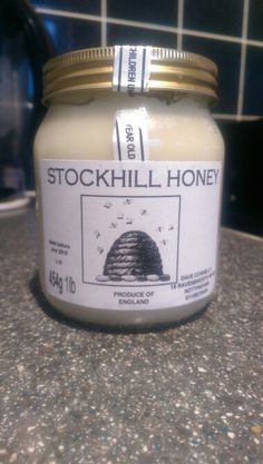 a jar of stockhill honey sitting on top of a counter