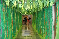 the hallway is decorated with green streamers and leaves