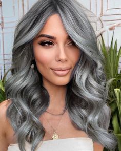 15 Stunning Winter Hair Color Ideas for Blondes in 2023-2024 - thepinkgoose.com Silver Hair Color Ideas For Brunettes, Silver Wavy Hair, Dark Silver Hair Color, Smokey Silver Hair, Grey Hair Colour, Dark Silver Hair, Grey Hair Model, Feathered Layers, Honey Blonde Hair Color