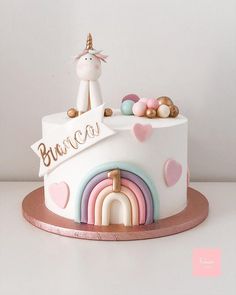 there is a cake with a unicorn on top