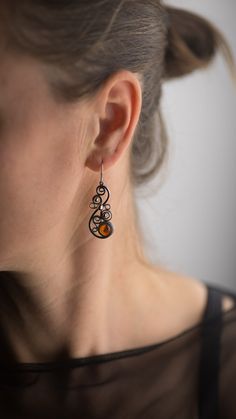 Beautiful handmade amber drop earrings for everyday wearing! :) All our items have been handmade with love and care more than 35 years ago by our family member - uncle Alfreds Holsts using the amber which he acquired in his lifetime. The amber that has been used making these rings, pendants, earrings and bracelets comes from the coast of the Baltic Sea (from 40,000,000 to 60,000,000 years old), which is the best-known and called succinite amber for containing a substantial amount of succinic aci Brown Baltic Amber Jewelry For Gift, Unique Baltic Amber Jewelry For Gifts, Unique Brown Earrings For Gift, Handmade Baltic Amber Teardrop Jewelry, Handmade Baltic Amber Jewelry For Gifts, Handmade Baltic Amber Jewelry Gift, Unique Amber Jewelry With Matching Earrings, Orange Wire Wrapped Earrings For Gift, Vintage Amber Drop Earrings