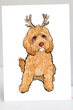 a brown dog with antlers on its head is sitting in front of a white background