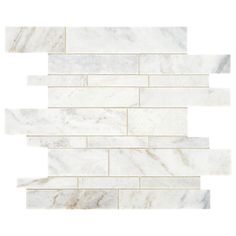 a white marble tile wall that looks like it has been cut in half and is being used