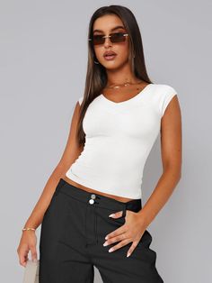 Y2k V-neck Stretch Top, Solid Stretch Y2k T-shirt, Trendy Fitted Elastane T-shirt, Y2k Style V-neck Stretch Top, Trendy Bodycon Top With Short Sleeves, Trendy Bodycon Short Sleeve Tops, Trendy High Stretch V-neck Tops, Bodycon Short Sleeve Elastane Top, Trendy White Elastane Tops