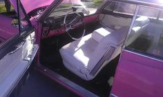 the interior of an old car is painted purple