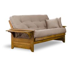 a wooden futon sofa with two pillows on it's back and one arm