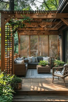 an outdoor living area with couches and chairs