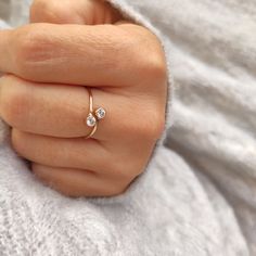 Dainty wrap ring with two cubic zirconia stones. Versatile and ideal for every day wear. The ring is slightly adjustable, but please do not bend with force.   PRODUCT DESCRIPTION ---------------------------------- * 3mm cubic zirconia stones * Band is approximately 1mm wide * Material: 14K Gold filled MEASURE YOUR RING SIZE ------------------------------------- If you are not sure about your ring size, visit your local jewellery store to get the size measured.   A little guidance:  1. Wrap some string around your finger and pull it over your knuckle. It is really important that the string can slice on and off the finger.  2. Mark the spots where the string meets.  3. Measure this length in mm on a ruler.  4. Compare the measured length with our size guide below.  5. Sizes comparisons is ac Diamond Bypass Ring With Vs Clarity As Gift, Fine Jewelry Bypass Ring With Single Diamond For Gift, Brilliant Cut Cubic Zirconia Bypass Ring As Gift, Round Cubic Zirconia Bypass Ring Gift, Diamond Accents Open Bypass Ring For Gift, Gift Fine Jewelry Bypass Ring In Diamond White, Gift Bypass Ring With Diamond Accents, Bypass Ring With Diamond Accents As Gift, Open Bypass Ring With Diamond Accents For Gifts