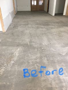 an empty room with the word before painted on it's floor and door in the background