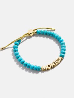 Add a signature touch to your wrist stack with the Turquoise Custom Nameplate Bracelet. Crafted with natural turquoise beads and the name of your choice, this bracelet makes for the perfect everyday statement. Trendy Turquoise Stackable Beaded Bracelets, Adjustable Turquoise Stretch Bracelet With Natural Stones, Everyday Turquoise Stackable Stretch Bracelet, Everyday Hand-strung Turquoise Stretch Bracelet, Everyday Turquoise Hand-strung Stretch Bracelet, Turquoise Stackable Adjustable Beaded Bracelets, Turquoise Personalized Jewelry, Adjustable Turquoise Stretch Bracelet, Adjustable Stackable Turquoise Beaded Bracelets