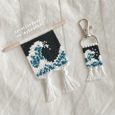 two keychains made out of bead and tassels on a white sheet