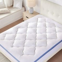 the mattress is made up and ready to be used in the bedroom or as a night stand