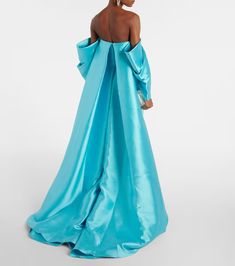 Kyla caped twill and crêpe gown in blue - Solace London | Mytheresa Pre-draped Gown With Cape Sleeves, Pre-draped Cape Evening Dress, Evening Blue Maxi Dress With Draped Sleeves, Blue Maxi Dress With Draped Sleeves For Evening, Fitted Cape Evening Dress For Gala, Elegant Cape Sleeves Dress For Prom, Evening Dresses With Sweep Train And Cape Sleeves, Elegant Dresses With Cape Sleeves For Prom, Elegant Prom Dress With Cape Sleeves