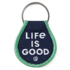 a blue and green keychain with the words life is good written on it