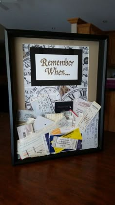 a shadow box with some newspaper on top of it and a sign that says, remember when