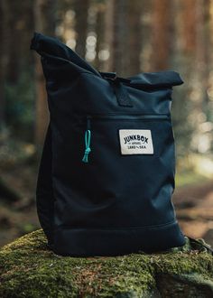 "Perfect for all you adventurers. Plenty of room to pack for a weekend away & added laptop compartment if you need to work on the go. 100% recycled polyester roll top rucksack finished with a woven patch & paracord zipper pull. Featuring a padded laptop compartment, compatible up to 15.6\". Small front zipper pocket for quick access things (keys, phone, wallet) + padded back panel, base & adjustable shoulder straps. -100% Recycled 600D Polyester -Recycled Polyester made from 100% rPET -Equivalent to 12 post-consumer bottles -PVC free -Padded back & base panels -Padded adjustable shoulder straps -Webbed grab handle -Rolled top -Clip fastening -Front zippered pocket -Padded laptop compartment -Laptop compatible up to 15.6\" -Water resistant lining -Paracord zip pullers Size: 32 x 44 x 13cm C Black Standard Backpack For Outdoor Activities, Black Travel Backpack For Outdoor Activities, Durable Black Bags For Adventure, Bag Packs, Practical Black Backpack For Adventure, Waterproof Backpack For Outdoor Activities, Black Backpack For Outdoor Travel, Black Travel Backpack For Outdoor, Black Backpack For Camping