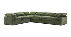 a green sectional couch with reclinings and pillows on the bottom half of it