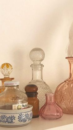 various glass vases and jars on a shelf