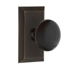 a black door handle with a round knob