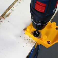 a drill is being used to fix a hole in the floor