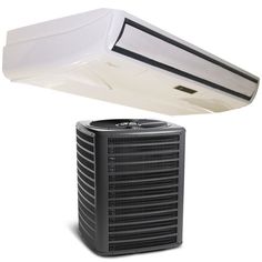 an air conditioner sitting on top of a white surface next to a black and white object