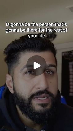 a man with a beard is looking at the camera and has a quote on it