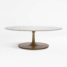 a white table with a brown base on a white background in the shape of an oval