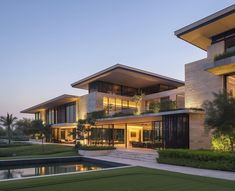 an exterior view of a modern house at dusk